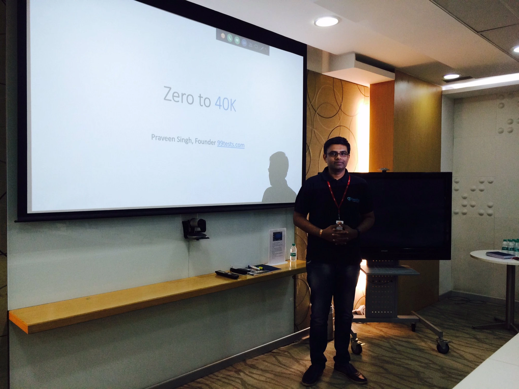 Praveen Singh, Founder of 99tests, speaking on stage